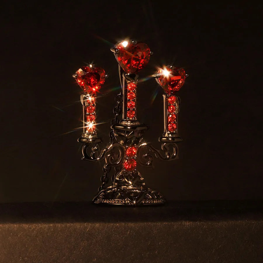 Close-up of a women's zinc alloy Gothic necklace with a hollow retro candlestick pendant on a cross chain.