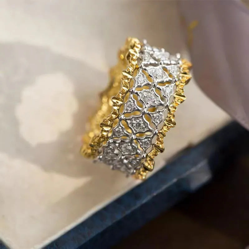 Geometric two-tone gold zircon ring with round elements on copper construction