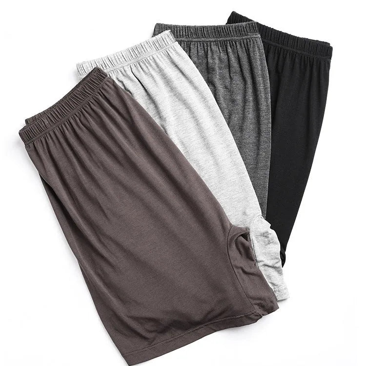 Men's solid colour modal boxer shorts in black, shown flat, highlighting the high-waisted design.