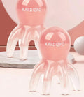 Pink octopus-shaped natural resin massage comb for periocular meridian, shown with its storage bag.
