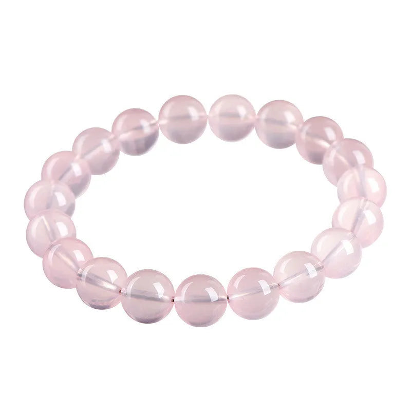 Natural starlight crystal women's bracelet with polished pink round beads in single circle design