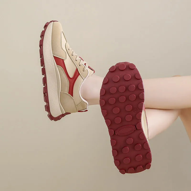 Women's solid colour low-top platform sports shoes with a rubber sole and front lace-up.