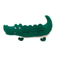 Green plush toy dog soft stuffed animal on white background.