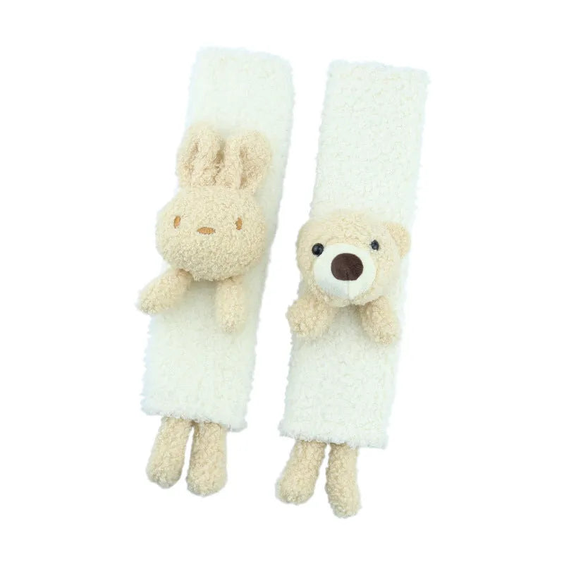 Soft plush car seatbelt shoulder protector with cartoon bear and rabbit designs made from lamb wool.