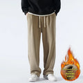 Men's apricot double-sided polar fleece loose-fit winter sports trousers with drawstring waist.