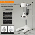Vertical stainless steel manual juicer with choice of coloured finishes and head attachments on a kitchen worktop.