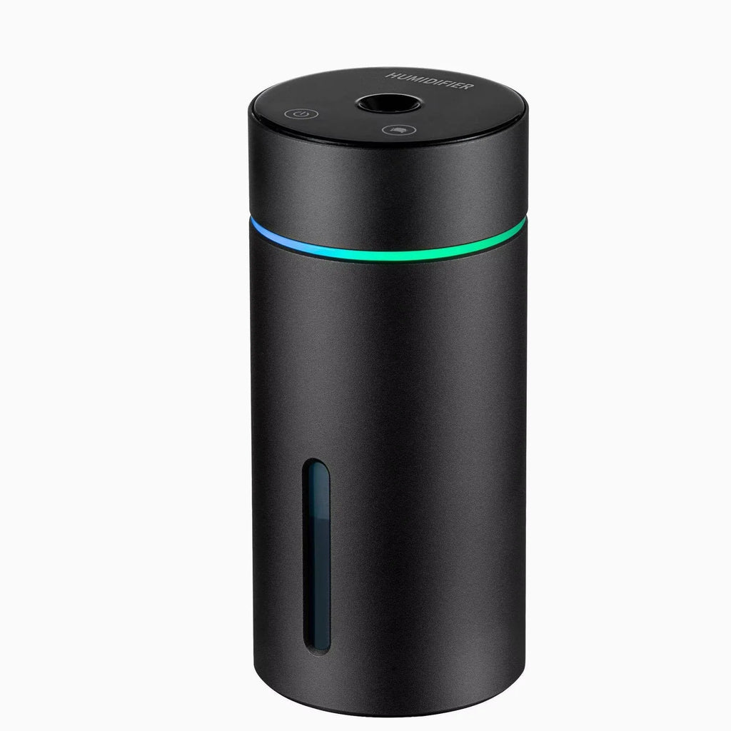 Black A6 aluminium alloy portable car humidifier and essential oil diffuser with USB cable on a desk.