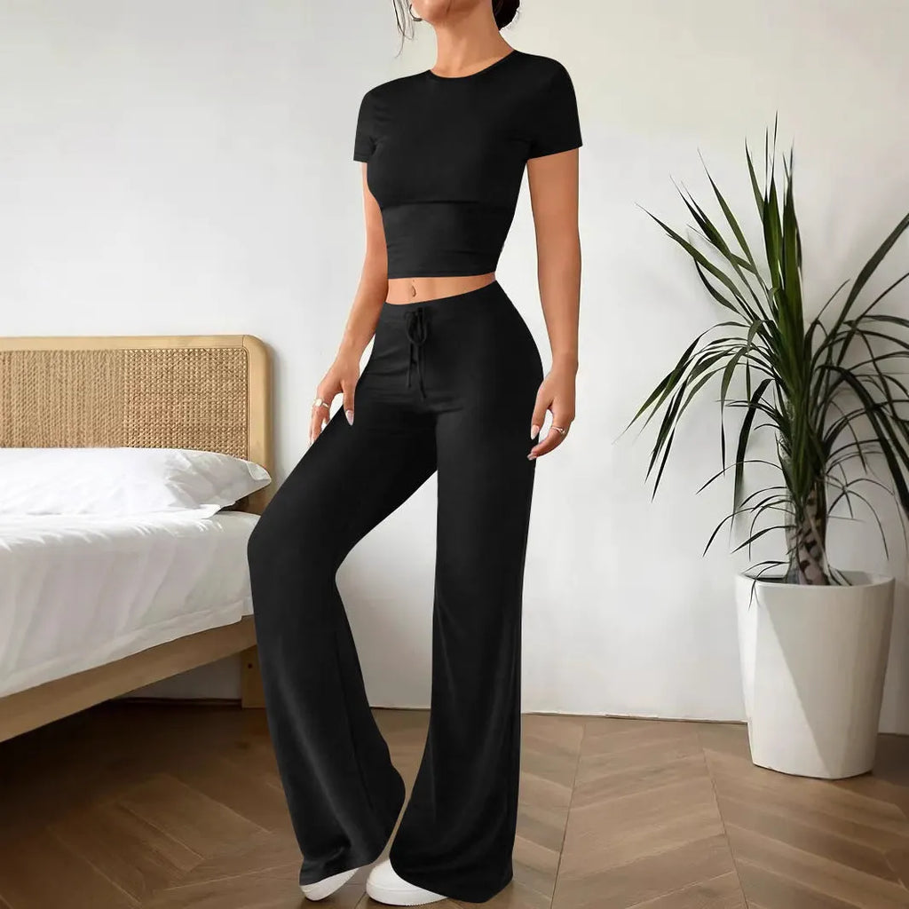 Black high waist trousers and short sleeve t-shirt co-ord set on hanger