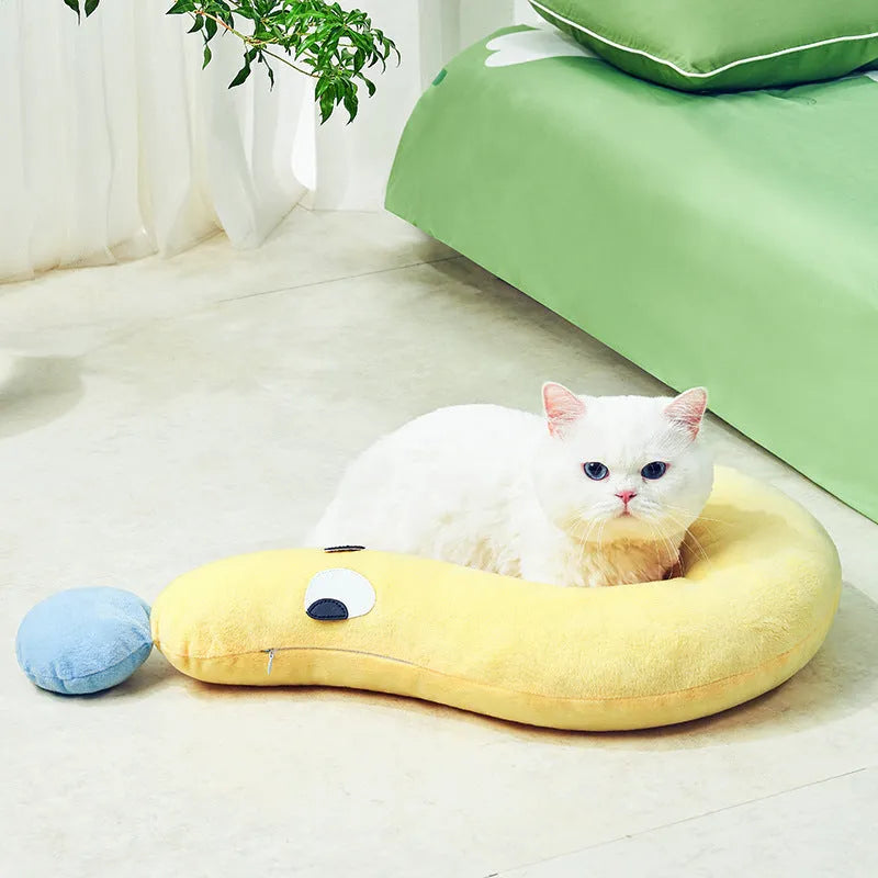 Blue rectangular pet sleeping cushion for cats and dogs on a wooden floor.