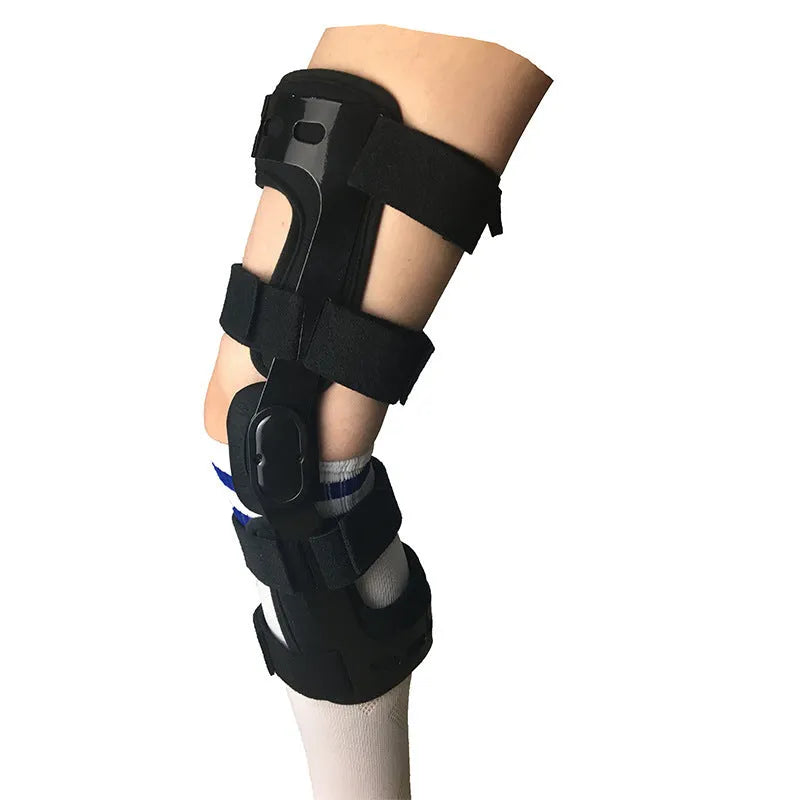Black anterior ligament knee pad supporter showing multi-material construction and buckle fastenings.