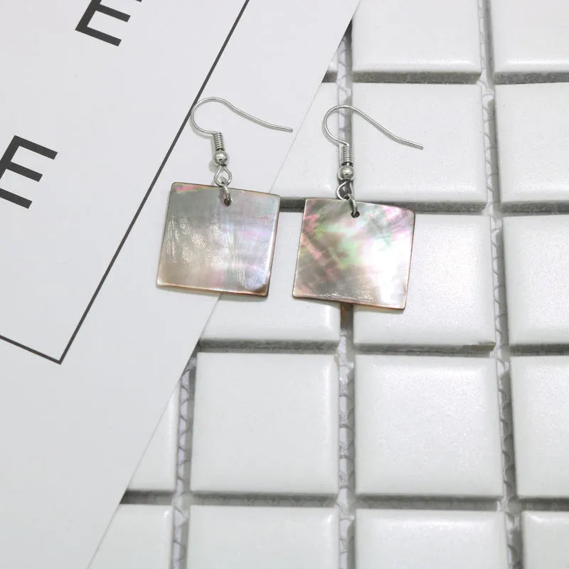 Women's geometric drop earrings made from real shell in square panther colour.