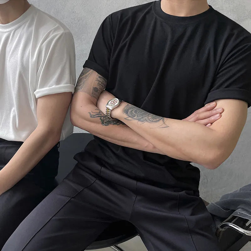 Mens slim fit cotton t-shirt in black on a hanger, showing round neck and half sleeves.