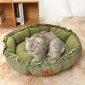 Grey reversible donut cat bed showing both raised rim side and flat sleeping side