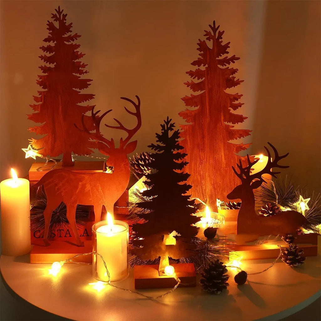 Three rusty metal Christmas tree decorations with elk silhouette cutouts