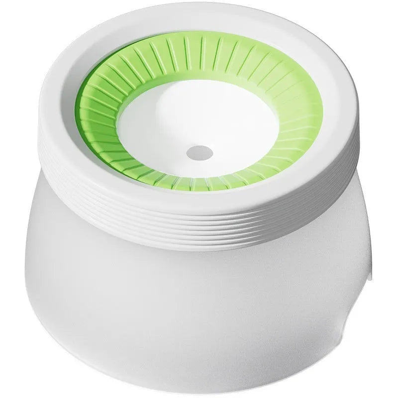 Green suspension water bowl for dogs and cats with non-wet mouth design on white background