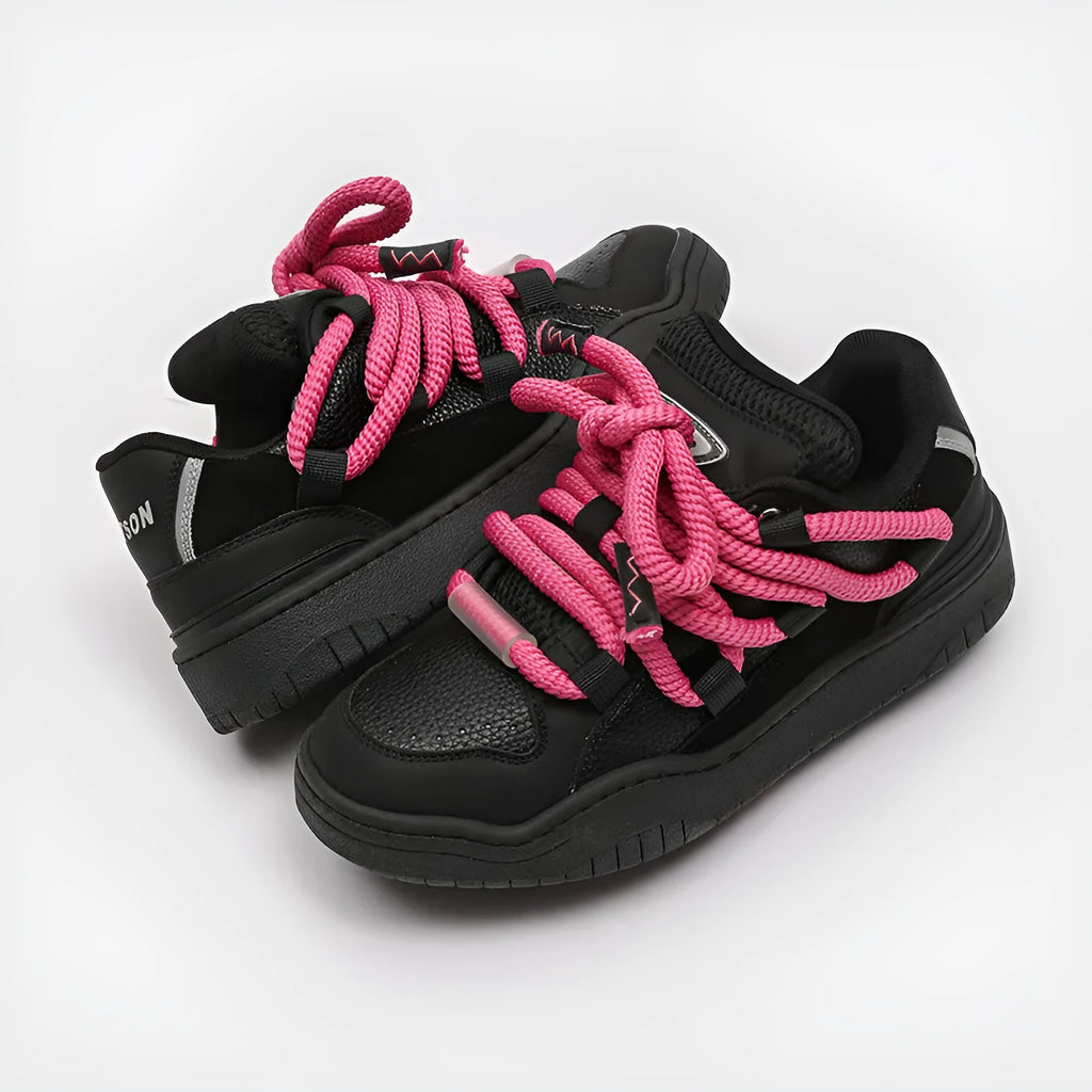 Pair of low-top unisex casual lace-up shoes with a thick rubber sole, shown in a solid colour.
