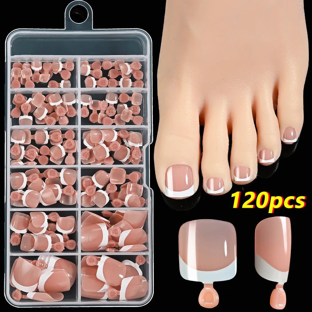 Open box showing 120 full square short French white edge toe nail tips in various nude shades.