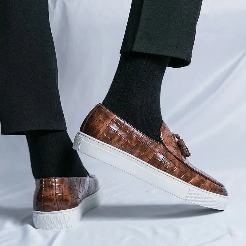 Men's black plus size tassel sneakers with round toe and oversleeve closure on a rubber sole.