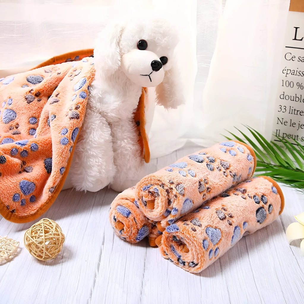 Coral fleece pet blanket with dog paw print pattern in beige, multiple sizes available