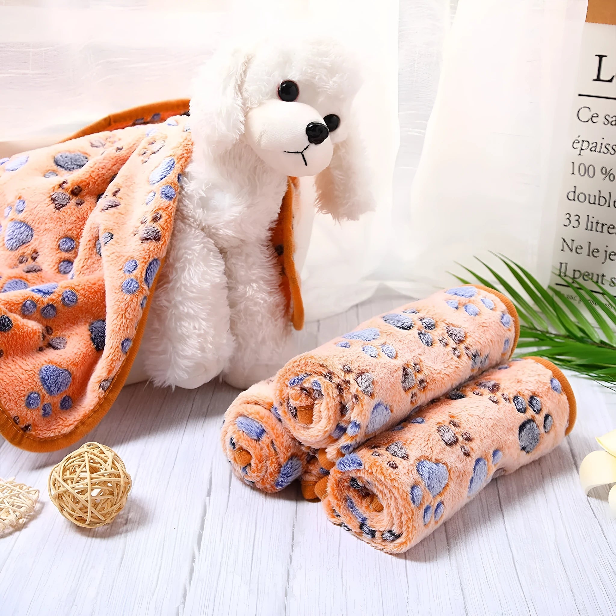 Coral fleece pet blanket with dog paw print pattern in beige, multiple sizes available
