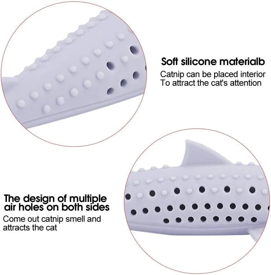 Green silicone fish-shaped chew toy for cats on a white background, showing side air holes.