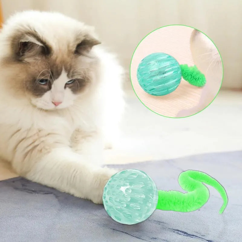 Interactive cat ball toy with plush tail in green, pink, and purple on white background