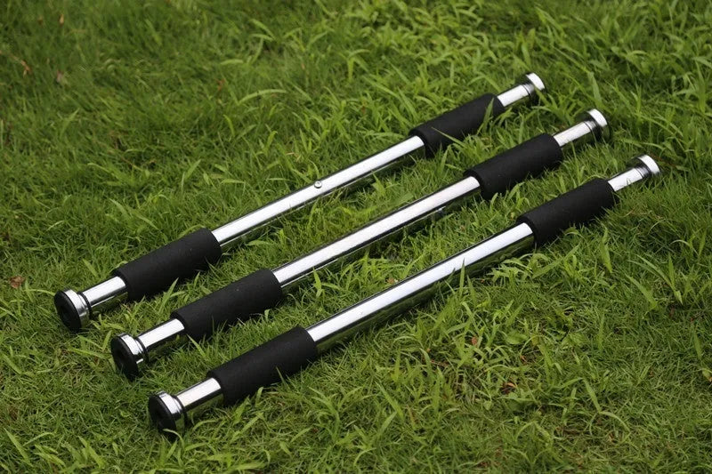 Steel adjustable pull-up bar mounted in doorway showing 62-100cm width range
