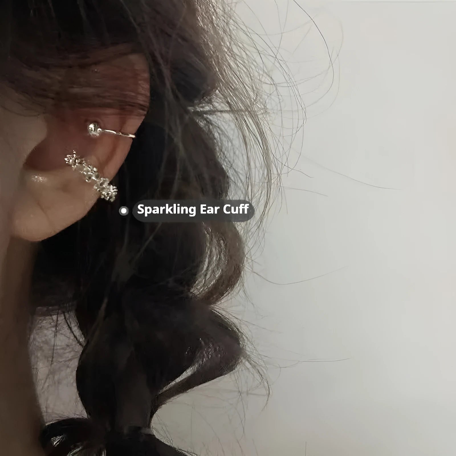 Pair of geometric irregular-shaped clip-on earrings with a frosty metallic finish.