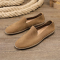 Handmade grey and khaki men's low-top casual sneakers with a cowhide upper and rubber wedge sole.