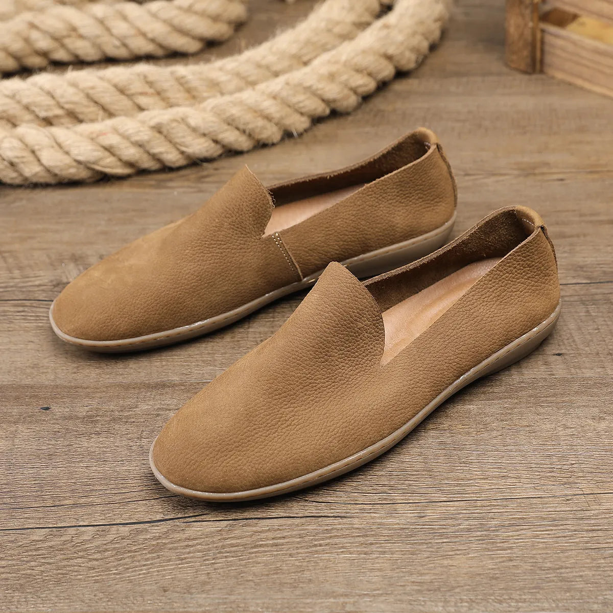 Handmade grey and khaki men's low-top casual sneakers with a cowhide upper and rubber wedge sole.