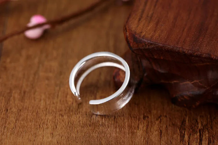 Geometric open ring with frosted silver finish and adjustable opening design