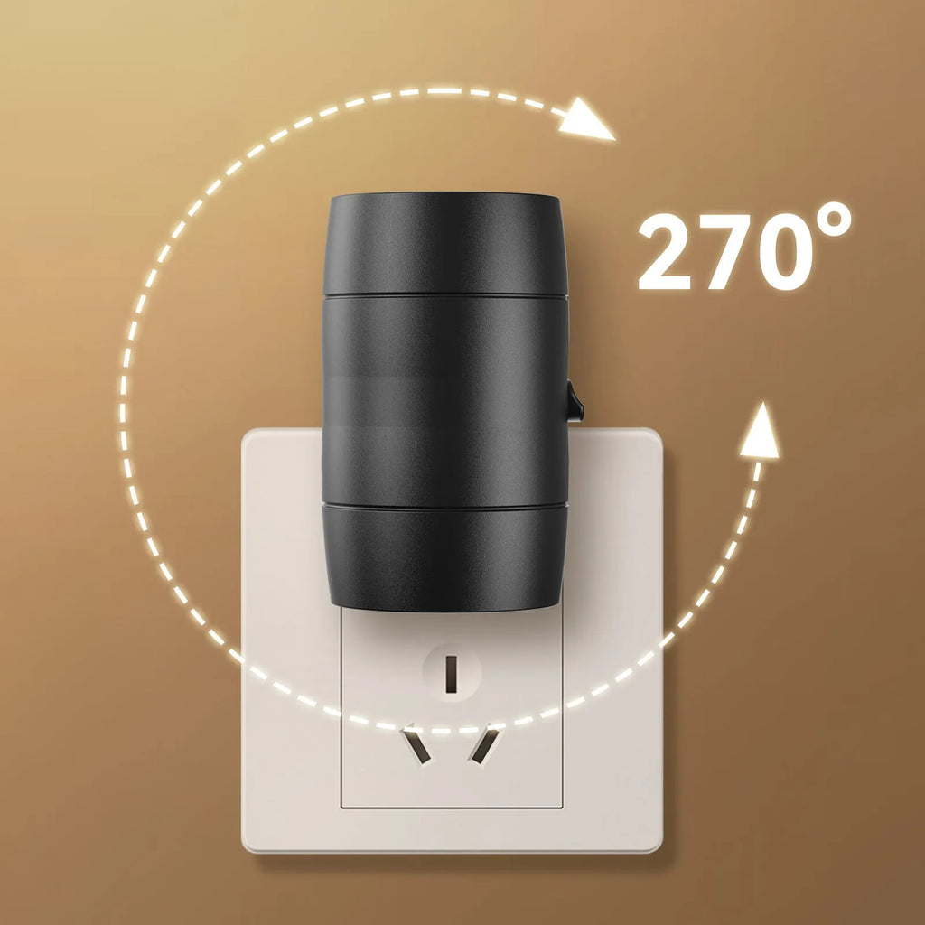 Small white plug-in night lamp with rotatable head showing adjustable brightness control, plugged into wall socket