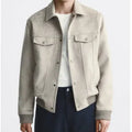 Men's light grey suede velvet British-style jacket with long sleeves on a model.