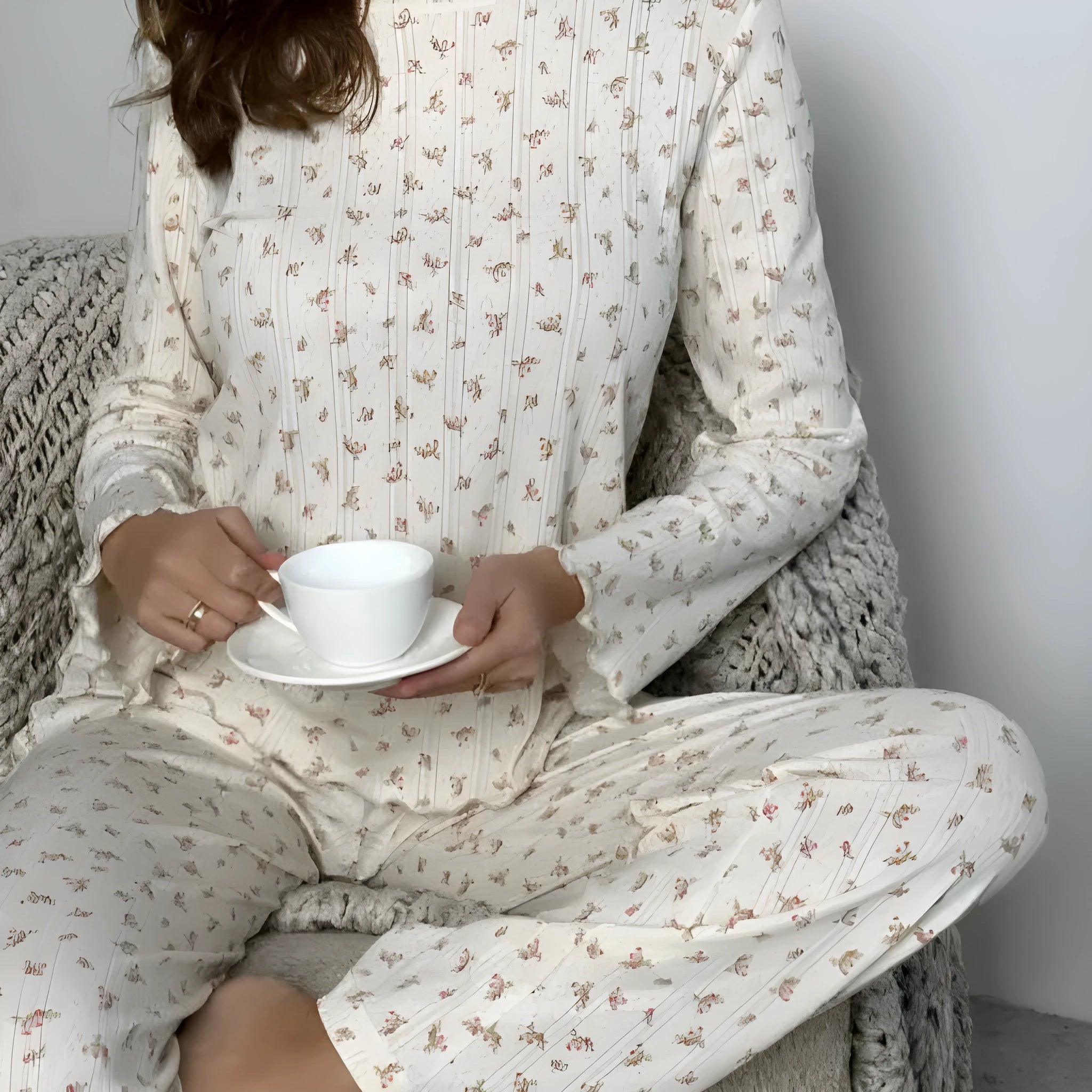 White floral print women's loungewear suit with bell sleeve top and wide-leg trousers