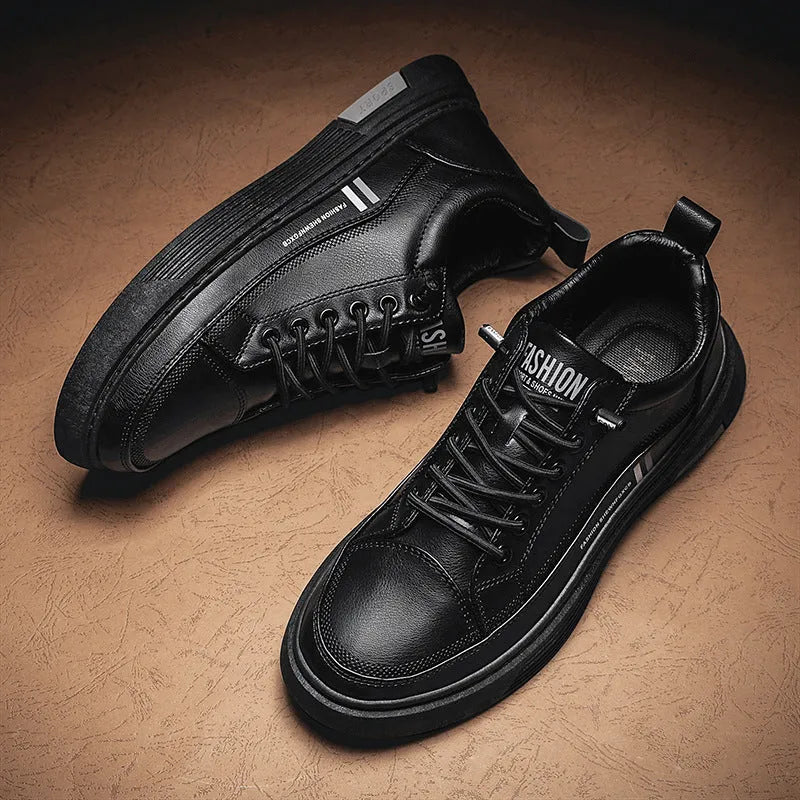 Men's low-top black and white skateboard shoes with elastic band closure and round toe.