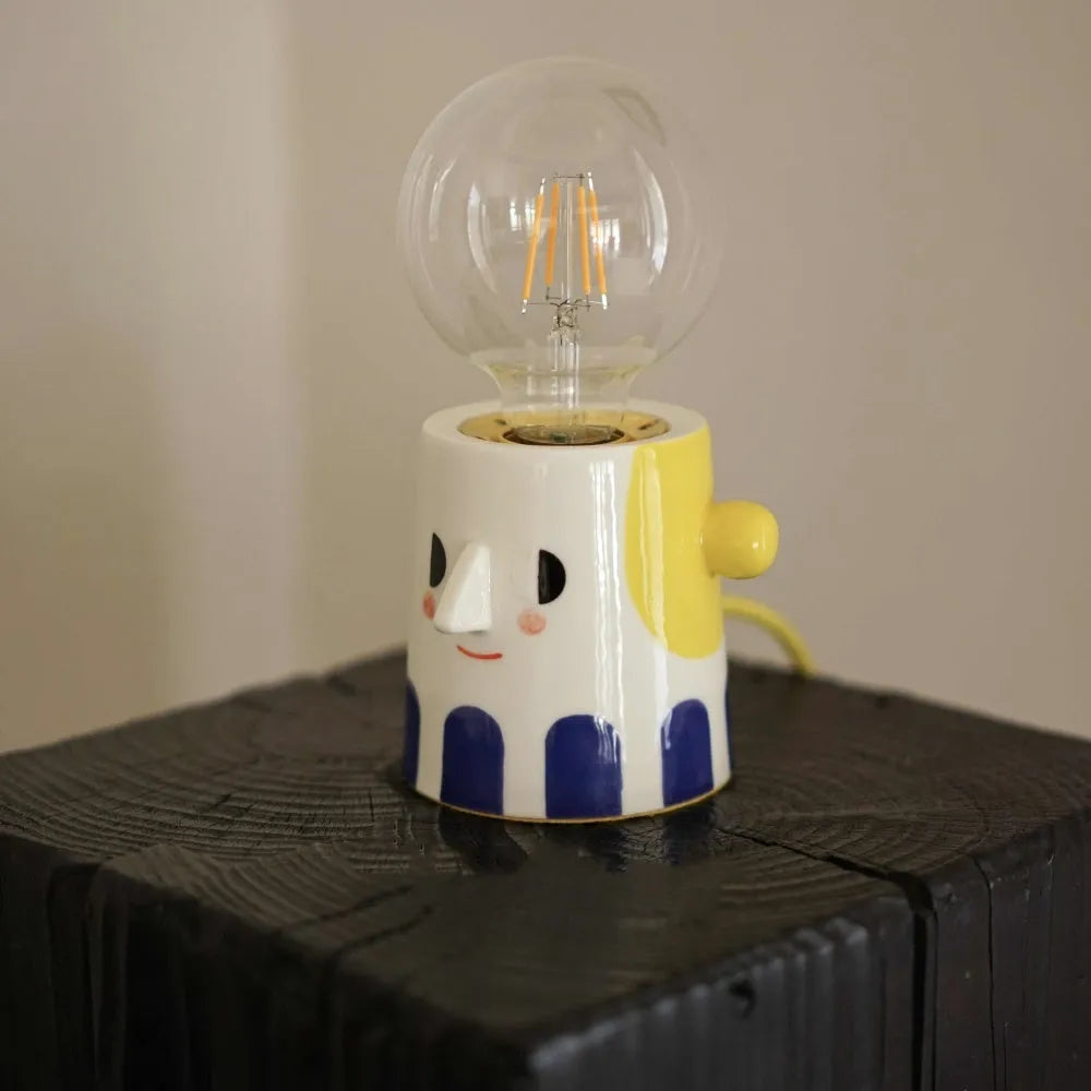 Handmade ceramic spherical ball headlight lamp on bedside table
