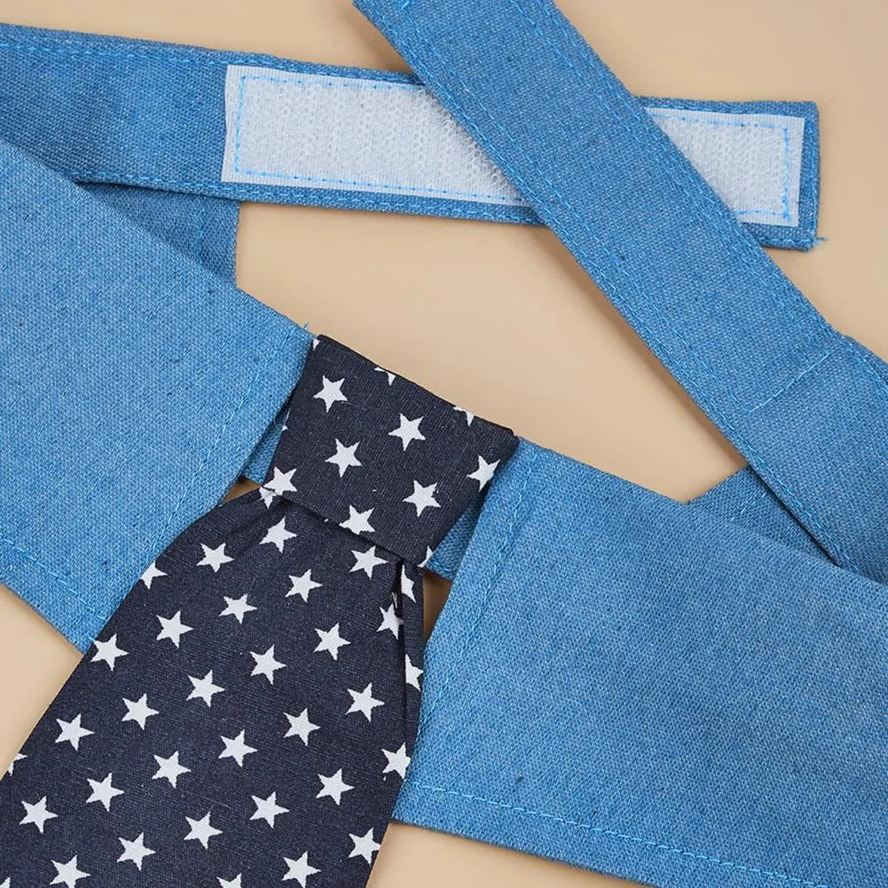 Denim pet collar with star pattern and bow tie on a table, adjustable fastener tape closure