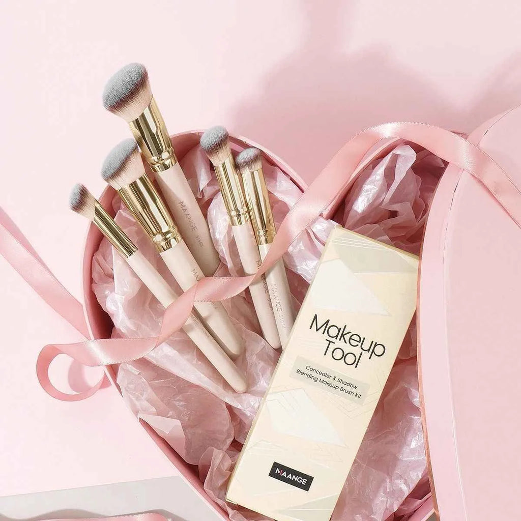 Five angled makeup brushes with apricot handles for powder, foundation and blush application