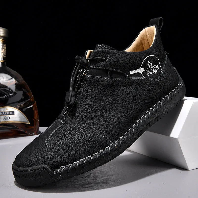 Men's black casual leather shoes with a round toe and mid-height rubber sole.
