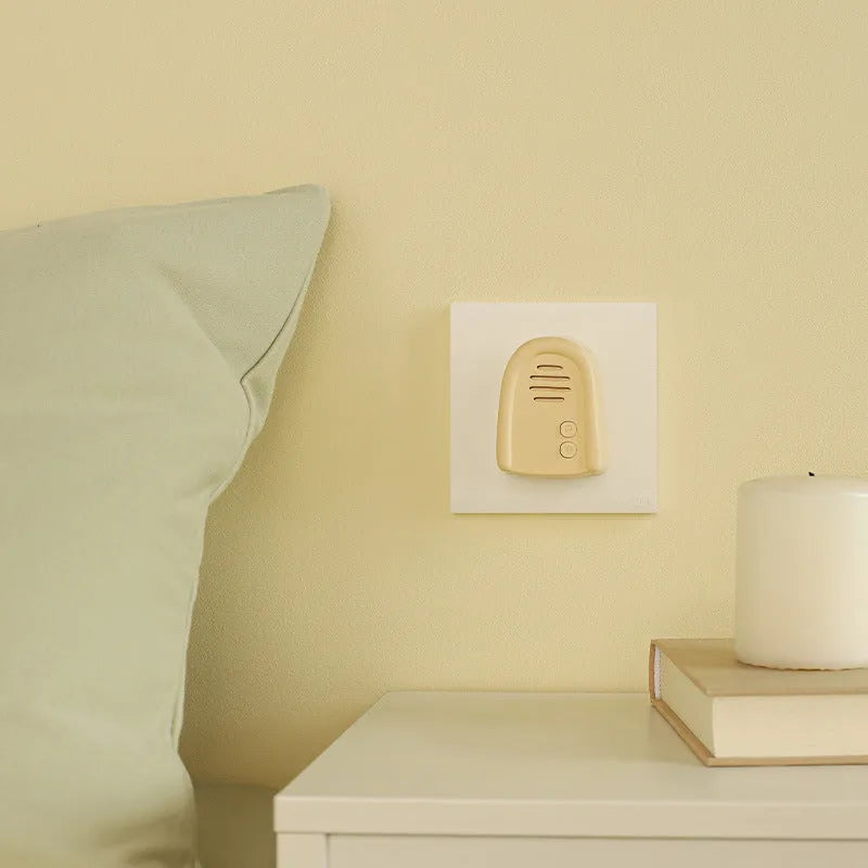 Wireless plug-in doorbell for household use in milky yellow or white colour with self-generating beeper mechanism