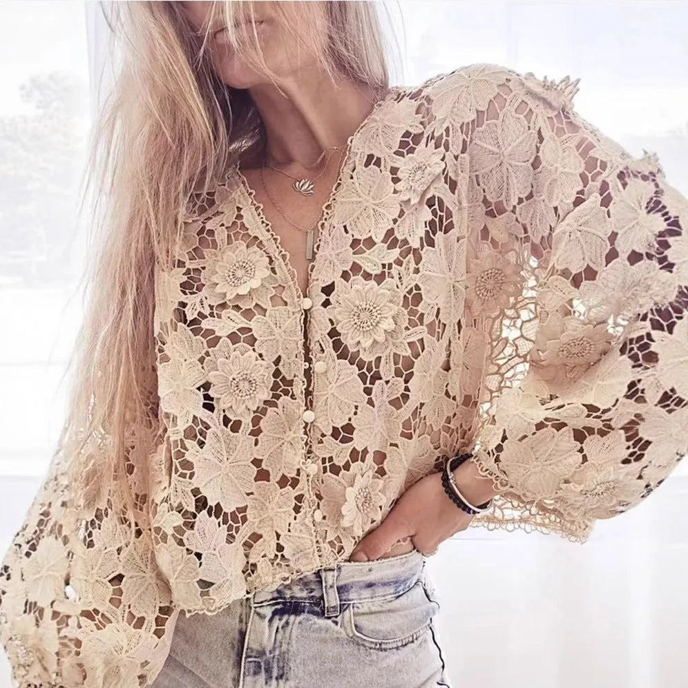 Women's loose black lace cardigan with three-dimensional white floral decoration and a V-neck.