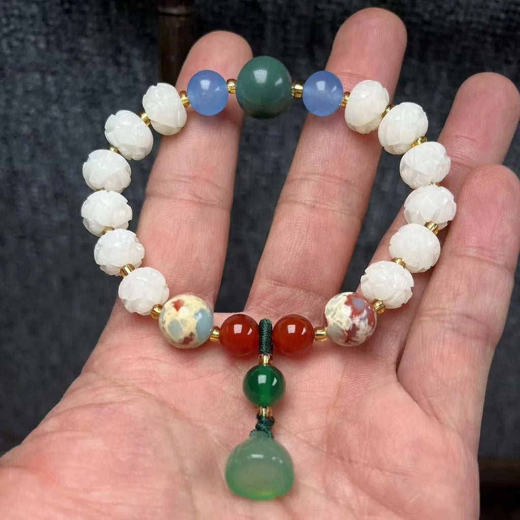 Hand-carved bodhi root bracelet with pumpkin lotus beads, white jade accents, and cat claw pendant