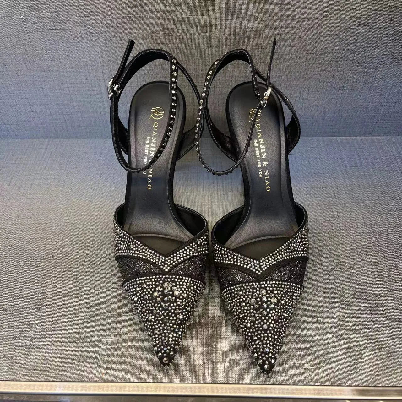 Women's hollow high heels with red sole, pointed toe stiletto design in black and silver colour options