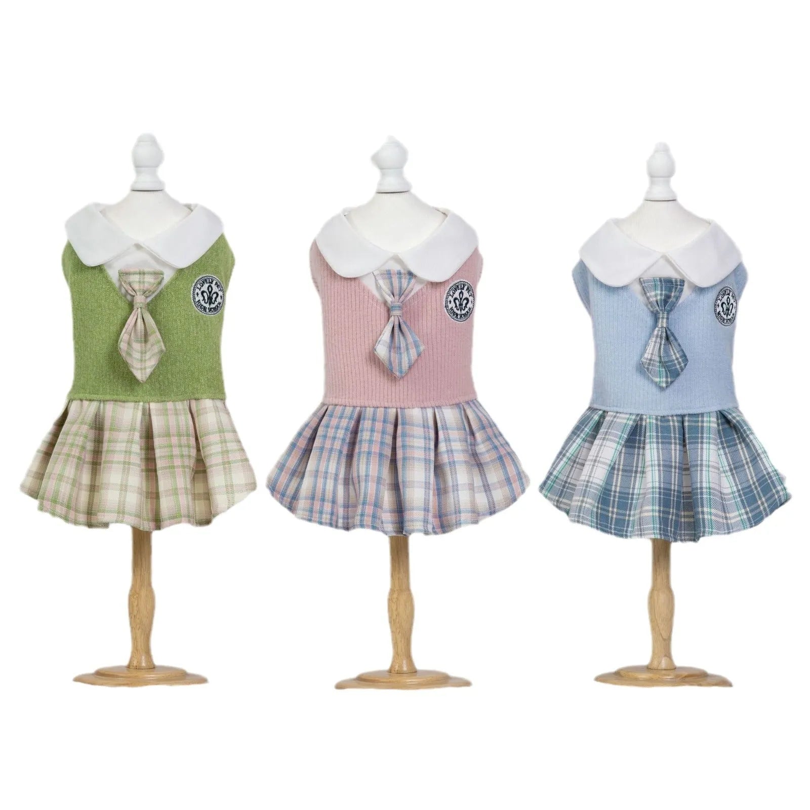 A pink tartan skirt for small dogs and cats with an adjustable velcro waist closure.