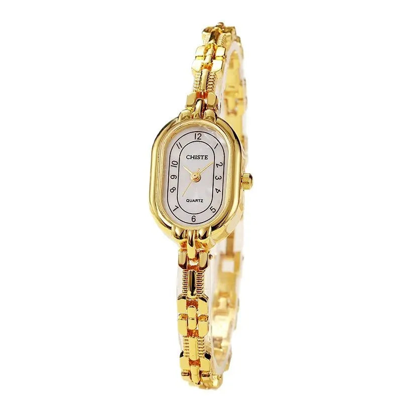 Retro oval women's quartz bracelet watch with metal strap and gold-tone dial