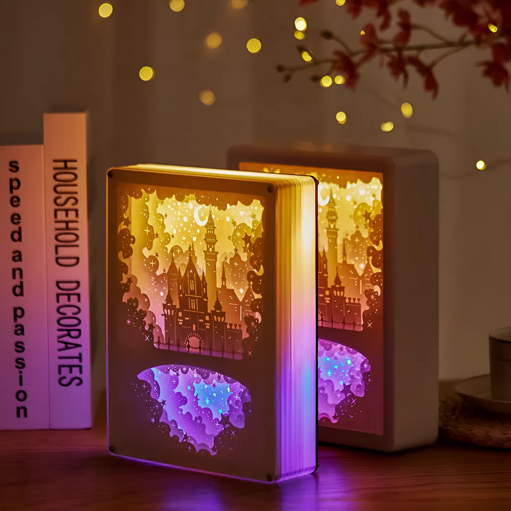 USB-powered bedside night light with three-dimensional paper carving design in yellow or purple light