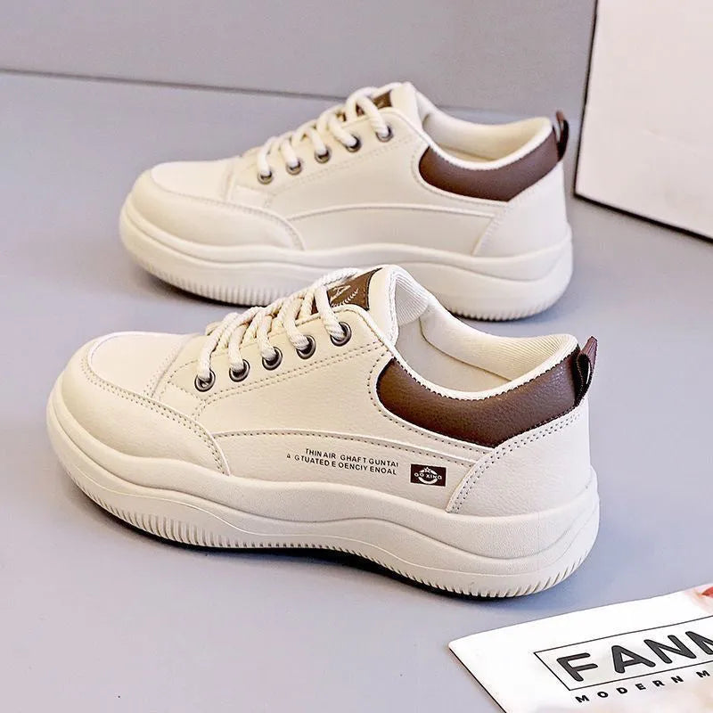 Women's white Korean style pumps with cross straps and lace-up design showing round toe and mid heel