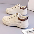 Women's white Korean style pumps with cross straps and lace-up design showing round toe and mid heel