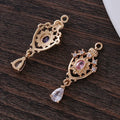 Water drop-shaped pendant with hollow crown design and micro inlaid zircon.