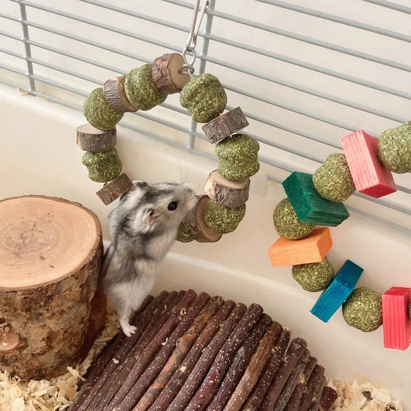 Hamster toy set showing decorative ring with straw ball and Applewood molar rod chew for small pets